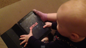 Baby working Netflix
