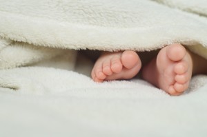 Baby Feet under blanket